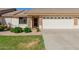 Charming single-story home with a well-manicured lawn and inviting front entrance, showcasing a beautiful facade at 11250 E Kilarea Ave # 276, Mesa, AZ 85209