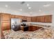 Well-equipped kitchen featuring stainless steel appliances, granite countertops, and ample cabinet space at 11250 E Kilarea Ave # 276, Mesa, AZ 85209