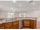 Open kitchen with granite countertops, stainless steel dishwasher, and a great view at 11250 E Kilarea Ave # 276, Mesa, AZ 85209