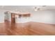Spacious living area with hardwood floors, a ceiling fan, and an open layout, perfect for entertaining and gatherings at 11250 E Kilarea Ave # 276, Mesa, AZ 85209