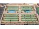 Overhead aerial view showcasing shuffleboard courts with shaded seating for community recreation at 11250 E Kilarea Ave # 276, Mesa, AZ 85209