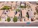 An aerial view featuring homes with backyard amenities such as a pool and putting green at 13434 W Rovey Ave, Litchfield Park, AZ 85340