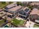 Aerial view of backyard featuring synthetic grass, a putting green, and a patio at 13434 W Rovey Ave, Litchfield Park, AZ 85340