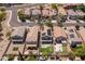 Birds-eye view of backyard featuring a pool, putting green, and covered patio at 13434 W Rovey Ave, Litchfield Park, AZ 85340
