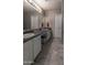 Bathroom with dual vanity, modern fixtures, and ample counter space at 13434 W Rovey Ave, Litchfield Park, AZ 85340