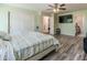 Bright bedroom features a bed, closet, and view to en-suite bathroom at 13434 W Rovey Ave, Litchfield Park, AZ 85340