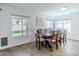 A cozy dining room filled with natural light and backyard views at 13434 W Rovey Ave, Litchfield Park, AZ 85340