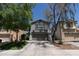 Gray two-story home with a well-maintained lawn and driveway and a two-car garage at 13434 W Rovey Ave, Litchfield Park, AZ 85340