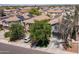 A street view of attractive homes with neat front yards and attached garages at 13434 W Rovey Ave, Litchfield Park, AZ 85340