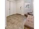 Inviting foyer with tile flooring, storage closet, and a stairway leading to the upper level at 13434 W Rovey Ave, Litchfield Park, AZ 85340