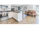 Modern kitchen overlooking dining room with stainless appliances at 13434 W Rovey Ave, Litchfield Park, AZ 85340