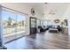 Bright living room with a large sectional sofa, and sliding door access to the outdoor living space at 13434 W Rovey Ave, Litchfield Park, AZ 85340