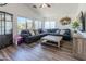 Spacious living room with vaulted ceiling, fan and large windows at 13434 W Rovey Ave, Litchfield Park, AZ 85340