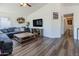Open-concept living room with vaulted ceilings and hardwood floors at 13434 W Rovey Ave, Litchfield Park, AZ 85340