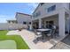 Covered patio perfect for outdoor dining and entertaining, with access to the backyard at 13434 W Rovey Ave, Litchfield Park, AZ 85340