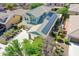 Lovely home featuring solar panels on the roof, along with a spacious driveway and verdant landscaping at 14897 W Valentine St, Surprise, AZ 85379