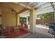 Covered back patio featuring pavers, outdoor furniture, and a built-in grill at 14897 W Valentine St, Surprise, AZ 85379