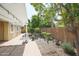 Landscaped back yard with patio and outdoor decor is perfect for enjoying the Arizona weather at 14897 W Valentine St, Surprise, AZ 85379