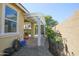 Cozy backyard showcasing a covered patio, gravel area, and beautiful plants at 14897 W Valentine St, Surprise, AZ 85379