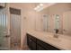 Bathroom featuring stylish vanity with great lighting, shower with curtain, and separate toilet at 14897 W Valentine St, Surprise, AZ 85379