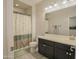 Bathroom featuring a shower with a bathtub, toilet, vanity, and tile floors at 14897 W Valentine St, Surprise, AZ 85379