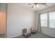 This is an empty bedroom with a rocking chair at 14897 W Valentine St, Surprise, AZ 85379
