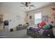 This spacious bedroom with fun decals and patterns, and convenient ensuite bathroom access at 14897 W Valentine St, Surprise, AZ 85379