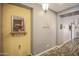Neutral walls in foyer, with laminate floors and warm accents at 14897 W Valentine St, Surprise, AZ 85379