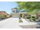 Charming two-story home features a well-manicured front yard and a spacious two-car garage at 14897 W Valentine St, Surprise, AZ 85379