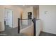 Hallway featuring neutral carpet, paint, white trim, and visible bedroom and closet entries at 14897 W Valentine St, Surprise, AZ 85379