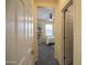 Hallway view into a bedroom featuring neutral walls and carpet and a ceiling fan at 14897 W Valentine St, Surprise, AZ 85379