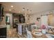Open concept kitchen featuring an island with seating, stainless steel appliances and modern finishes at 14897 W Valentine St, Surprise, AZ 85379