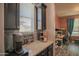 Cozy kitchen nook features black cabinets, granite countertops and coffee bar area at 14897 W Valentine St, Surprise, AZ 85379