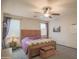 Relaxing main bedroom with a wooden bed, carpeted floors, and neutral colors, designed for rest and rejuvenation at 14897 W Valentine St, Surprise, AZ 85379