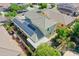 Aerial view of home highlighting solar panels, covered patio, and landscaped backyard at 14897 W Valentine St, Surprise, AZ 85379