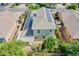 Aerial view of home featuring solar panels on roof, covered patio, and spacious backyard at 14897 W Valentine St, Surprise, AZ 85379