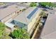 Aerial view of home with solar panels, a covered patio, and lush backyard landscaping at 14897 W Valentine St, Surprise, AZ 85379