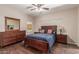 Cozy bedroom with hardwood floors, full-sized bed, dresser, and serene ambiance at 15225 N 100Th St # 1209, Scottsdale, AZ 85260