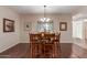 Bright dining area with wood table, chairs, chandelier, and natural light at 15225 N 100Th St # 1209, Scottsdale, AZ 85260