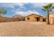Fully enclosed xeriscaped backyard featuring gravel, desert landscaping, and a private fence at 16261 W Custer Ln, Surprise, AZ 85379