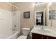 Bathroom with shower-tub combination, single sink vanity, and neutral finishes at 16261 W Custer Ln, Surprise, AZ 85379