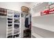 Walk-in closet with custom shelving and ample storage space at 16261 W Custer Ln, Surprise, AZ 85379