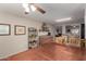 Dining area features a ceiling fan and view to the kitchen and living area at 16261 W Custer Ln, Surprise, AZ 85379