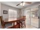 Dining room features a ceiling fan and sliding glass door to backyard at 16261 W Custer Ln, Surprise, AZ 85379