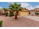 Attractive home featuring desert landscaping and a spacious two-car garage at 16261 W Custer Ln, Surprise, AZ 85379
