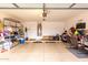 Spacious two-car garage with ample storage space and a clean, sealed concrete floor at 16261 W Custer Ln, Surprise, AZ 85379