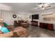 Cozy living room with tile flooring, comfortable seating, and modern amenities at 16261 W Custer Ln, Surprise, AZ 85379