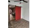Bonus room with tile flooring and red sliding barn door at 1629 E Garfield St, Phoenix, AZ 85006