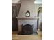 Arched fireplace with decorative screen and vintage clock on the mantel at 1629 E Garfield St, Phoenix, AZ 85006