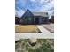 Quaint home with arid landscaping, concrete walkway, and red outdoor furniture at 1629 E Garfield St, Phoenix, AZ 85006
